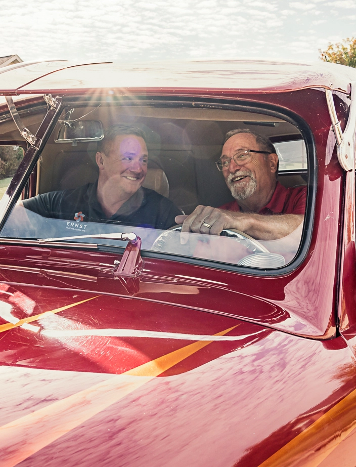 Roger and Dusty Ernst in a red car