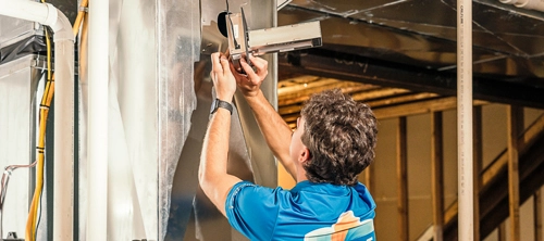 an Ernst technician installs a UV-C light